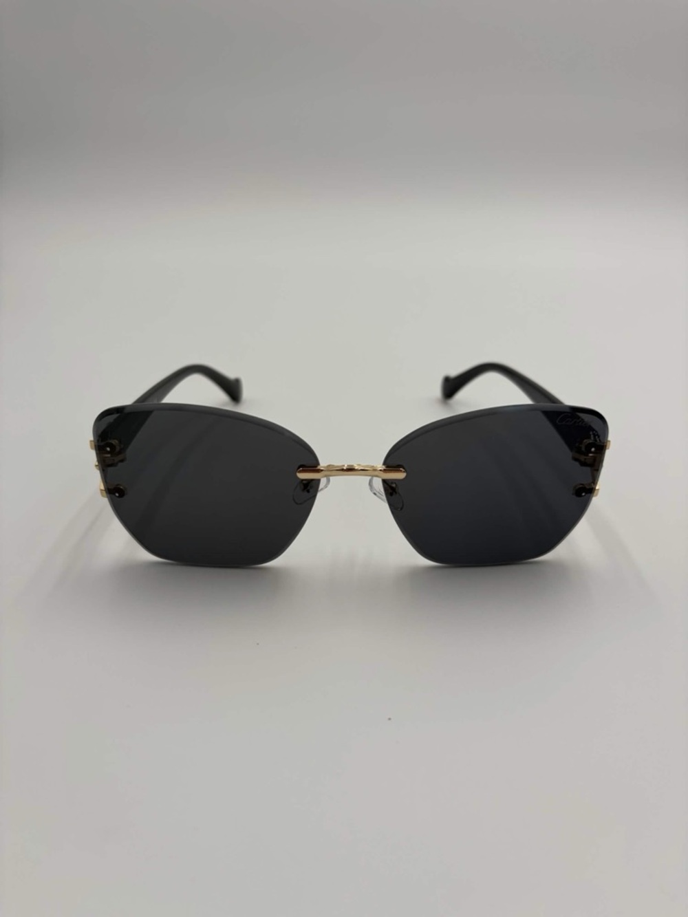 Cartier Rimless Sunglasses with Black Lenses and Gold Bridge